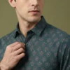 Men’s teal printed cotton shirt close-up with micro motif pattern and classic collar