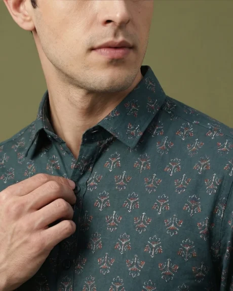 Men’s teal printed cotton shirt close-up with micro motif pattern and classic collar