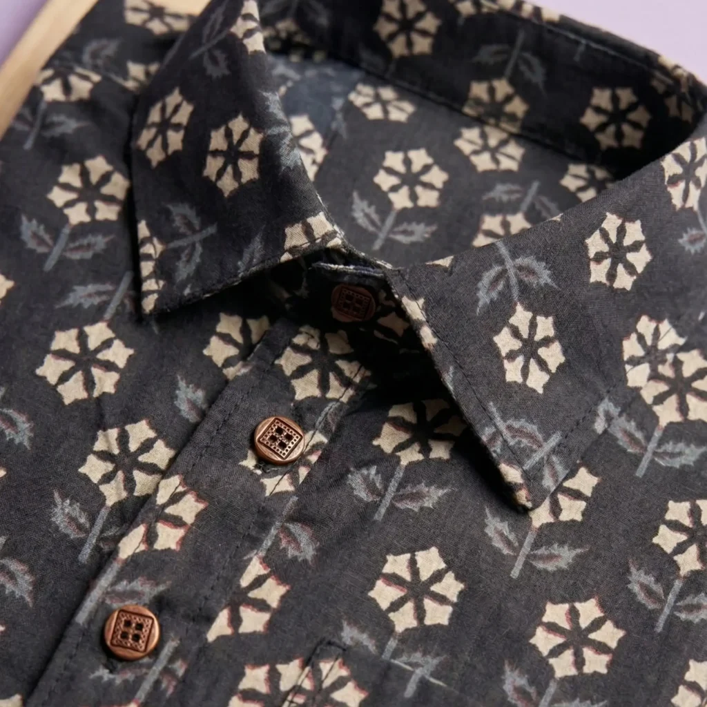 Close-up of premium cotton fabric floral print shirt with designer buttons for men