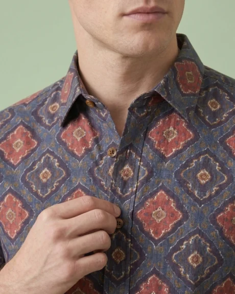 Men’s indigo geometric printed cotton shirt close-up with classic spread collar and button detail